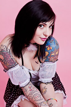 Tattooed Girl In Pink Room