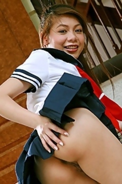 Cute Asian in schoolgirl uniform