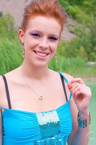 Redhead cutie posing outdoor