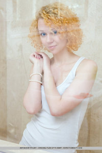 Cute redhead takes a shower
