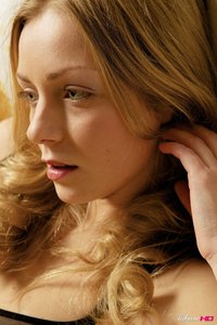 Blond teen takes off her black lingerie