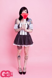 Tattooed Girl In Pink Room