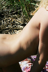 Nude girl is lonely at the beach