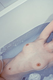 Sexy girl takes a hot bath