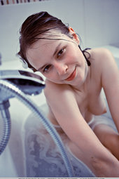 Sexy girl takes a hot bath