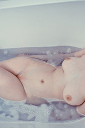 Sexy girl takes a hot bath