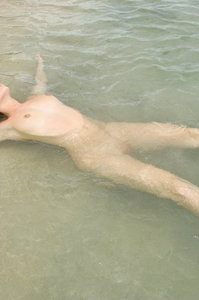Alissa posing nude by the sea